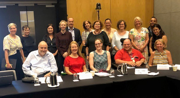 NDIS Review panel member Kevin Cocks and co-chair Lisa Paul with 15 disability and community organisation representatives