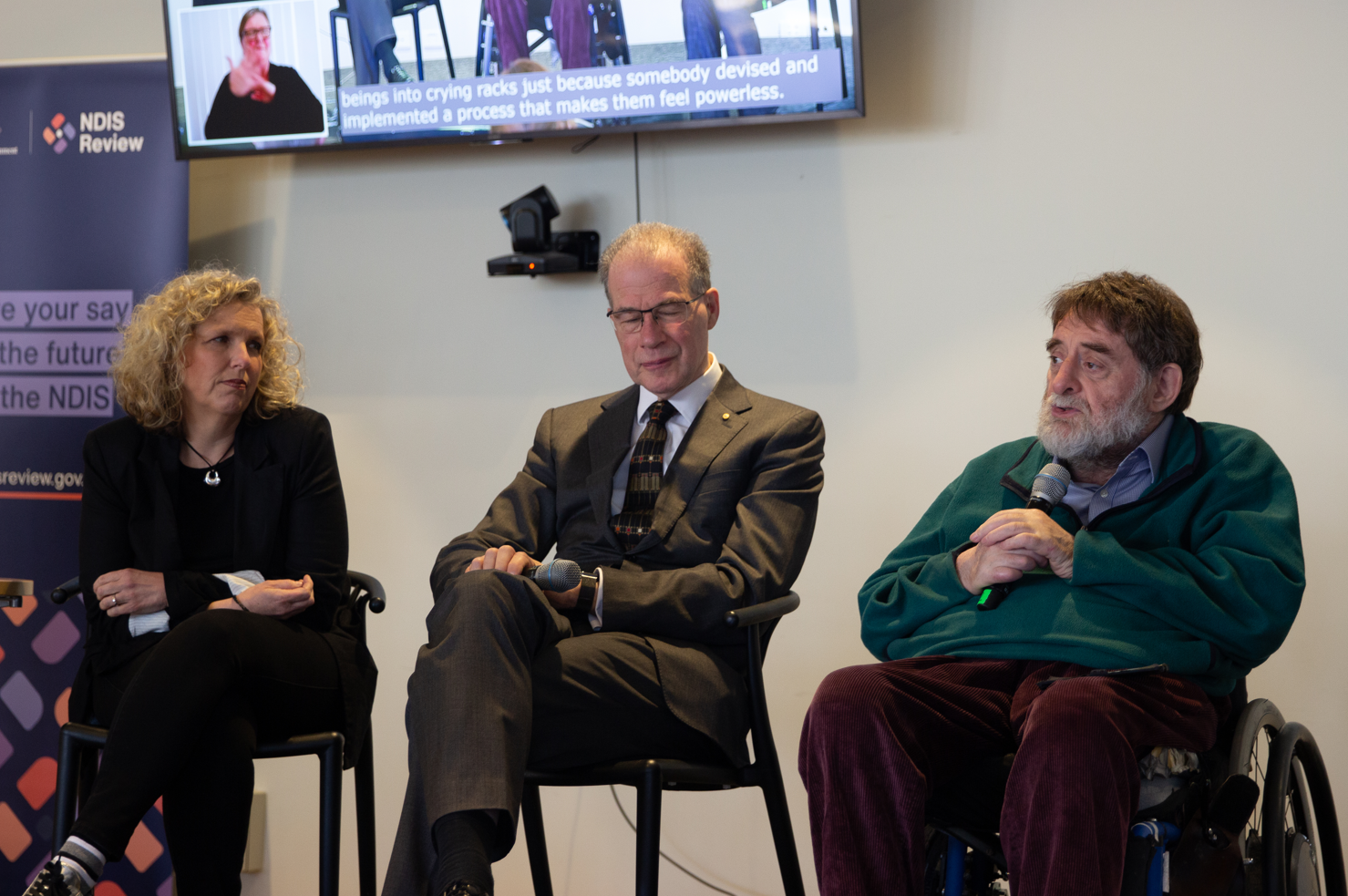 NDIS Review Panel Co-Chair Bruce Bonyhady (centre) and panel members Kirsten Deane (left) and Dougie Heard (right) speaking to community members in Geelong.