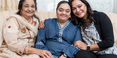 Image of 3 people together on a couch