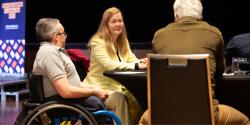 Audiences members seated at a table