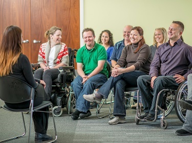 A group of people taking part in a meeting. 