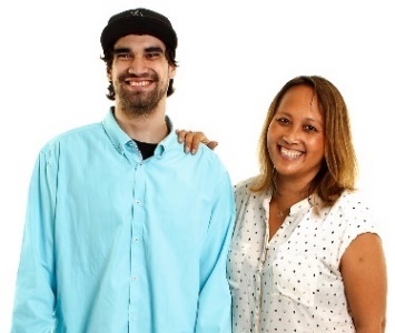 A woman supporting a man. They are both smiling.